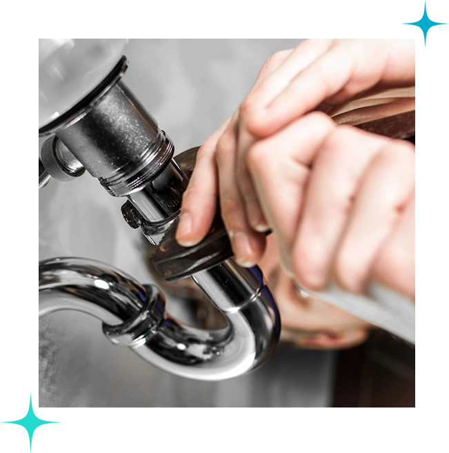 A person is fixing the faucet of a sink.