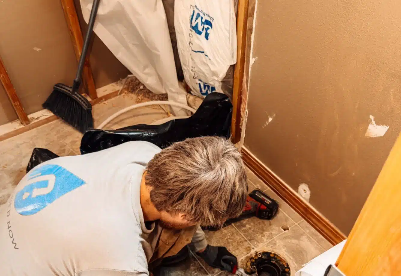 Plumber clearing a clogged drain in McMinnville, Oregon