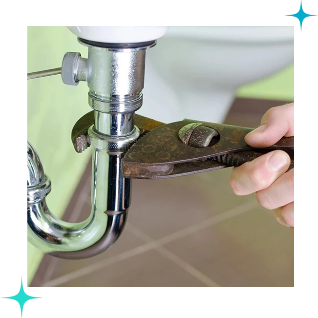 A person is fixing the faucet of a toilet.