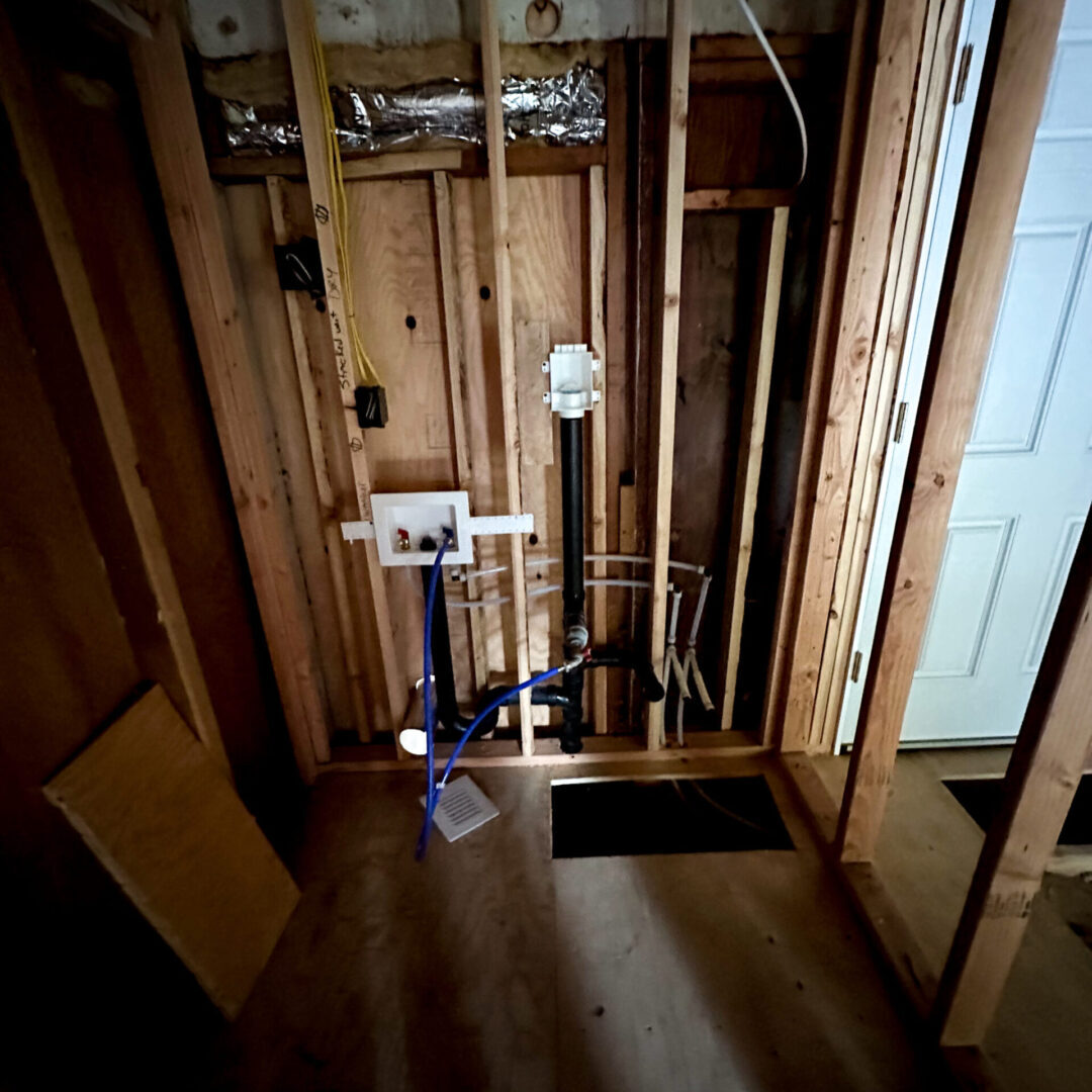 A bathroom with wood walls and floor in it